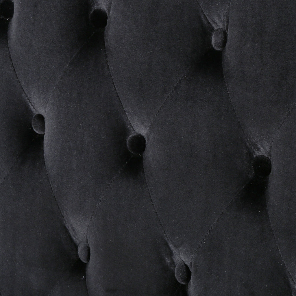 Canapé deux places à oreilles haut capitonné en velours noir