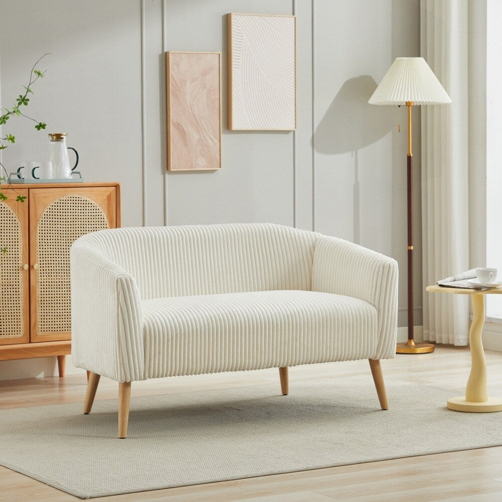 Canapé 2 places recouvert de tissu velours côtelé avec pieds en noyer