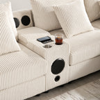 Canapé d'angle en velours côtelé avec haut-parleurs Bluetooth, chargeur USB, porte-gobelets, rangement, pouf et assise profonde et large.