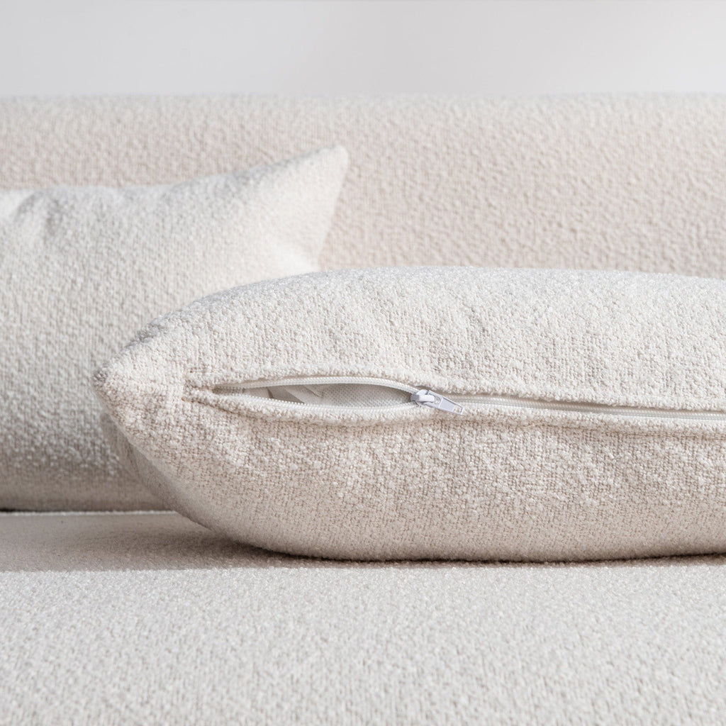 Canapé 2 places KINWELL en tissu bouclé avec coussins