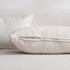 Canapé 2 places KINWELL en tissu bouclé avec coussins