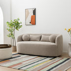 Canapé 2 places KINWELL en tissu bouclé avec coussins