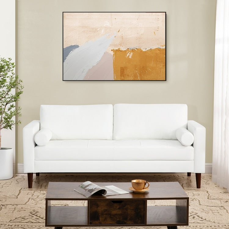 Canapé moderne en cuir véritable avec pieds en bois et coussin supplémentaire.