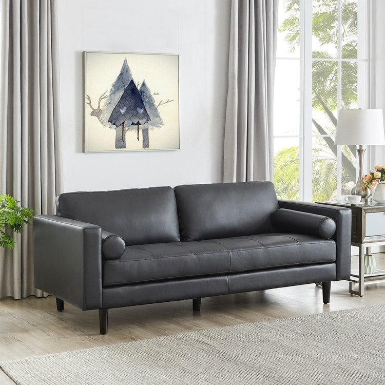 Canapé moderne en cuir véritable avec pieds en bois et coussin supplémentaire.